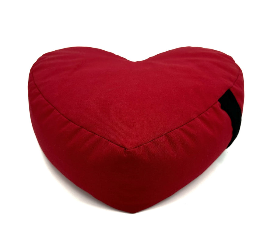 Red heart-shaped zafu meditation pillow on a white background
