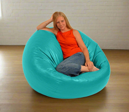Vinyl beanbag beautiful woman sitting in bean bag chair comfy bean aqua color by Bean Products