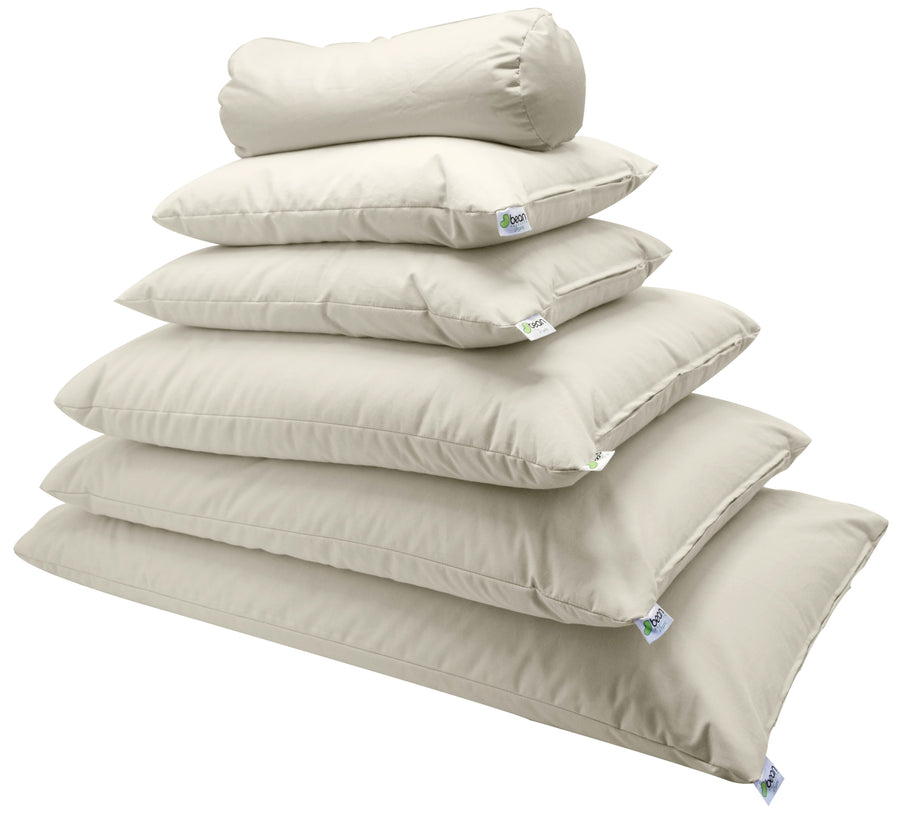 Stack of organic cotton dust mite proof pillow protectors in natural color