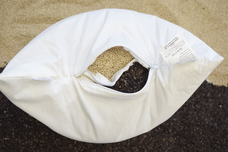 edge view of openings showing organic millet and buckwheat hulls inside wheatdreamz multi-grain therapeutic pillow