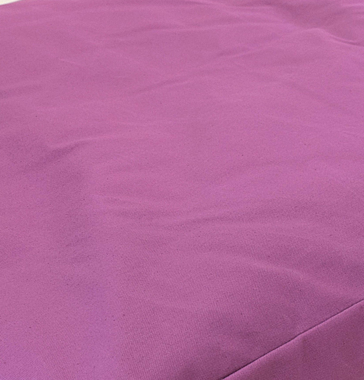 Pink cotton bean bag loveseat fabric texture close-up