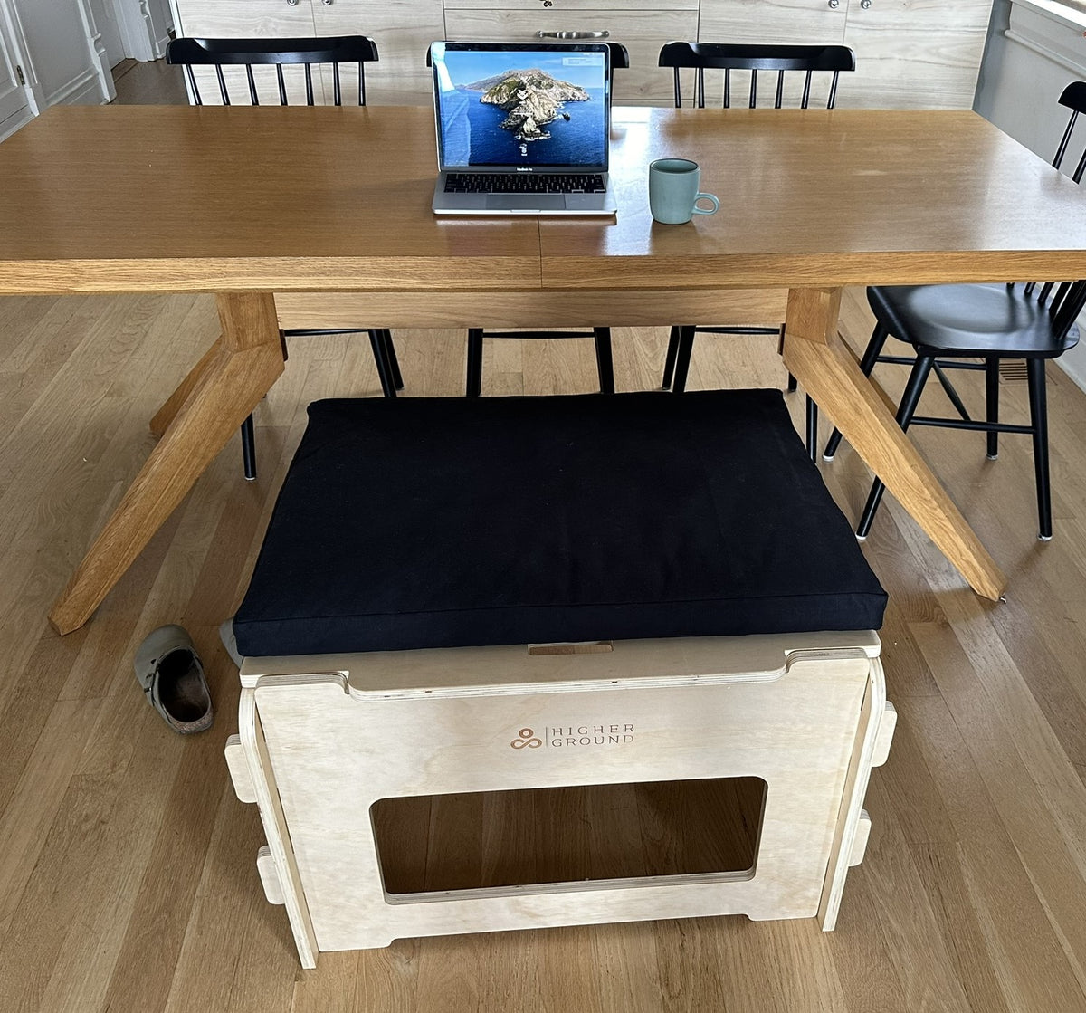 Back view of person using active sitting posture chair at desk workspace