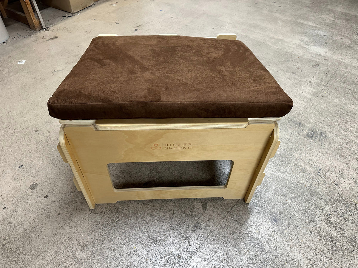 Brown cushion ergonomic meditation stool on wooden base