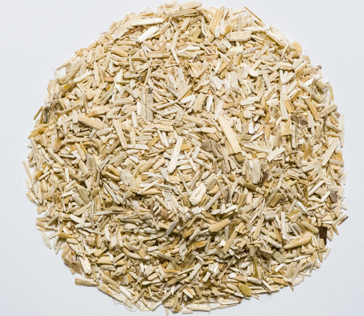 Close-up circular view of hemp mulch hurd texture showing shredded fibers