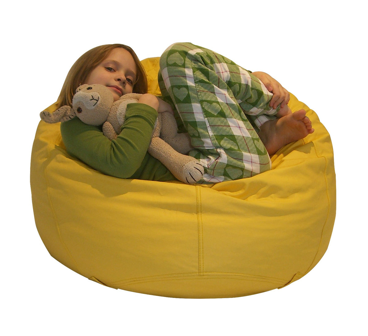 Child lying on yellow bean bag chair, cozy outdoor seating for kids
