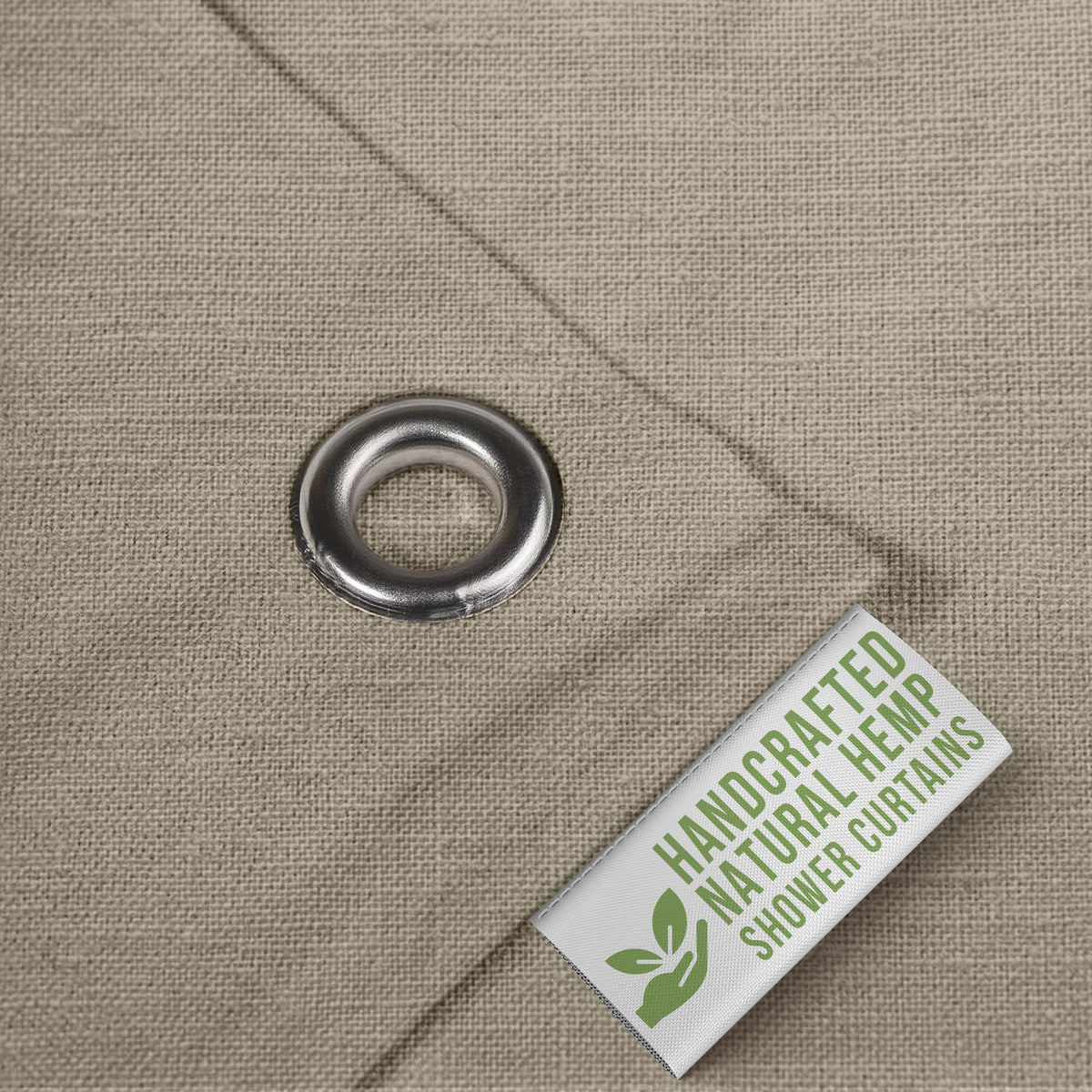 Close-up of rust-resistant grommet on hemp shower curtain