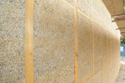 Hempcrete wall insulation made with organic hemp hurd in a timber frame construction wall
