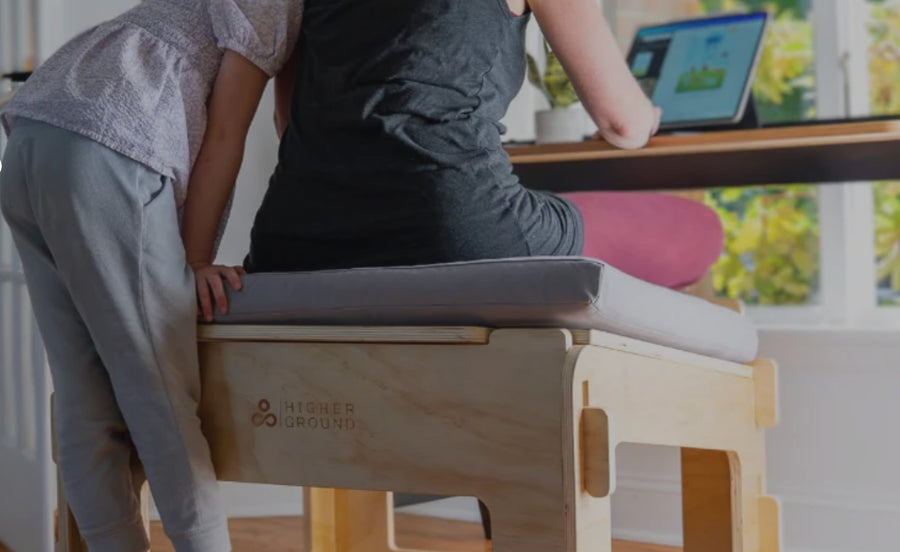 Person adjusting ergonomic active sitting chair with adjustable angle platform for meditation and posture support