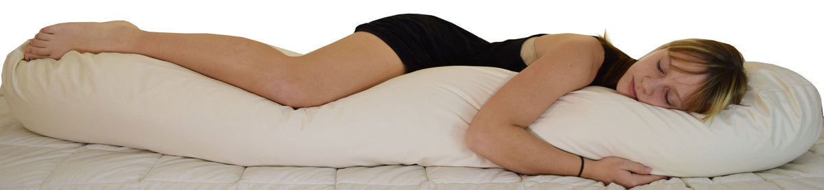 Child lying with kidney bean body pillow for full body support, ergonomic cushion for improved sleep posture and comfort