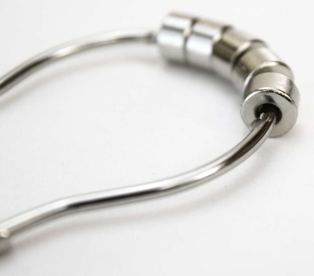 Metal shower curtain ring and hook close-up, durable rust-resistant hardware