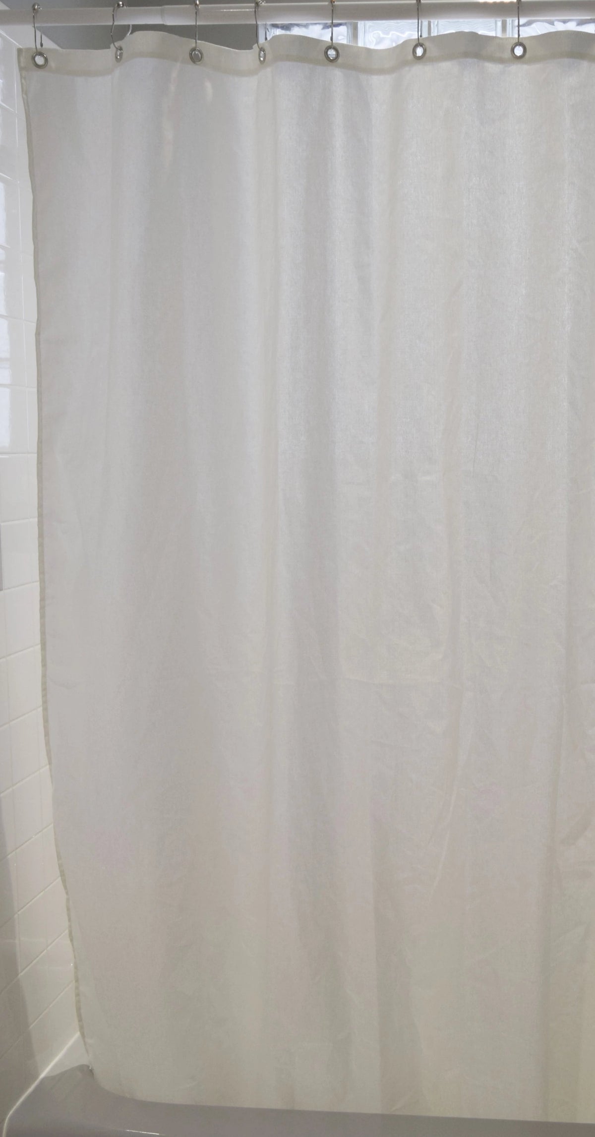 White cotton shower curtain full-length view for bathtub installation