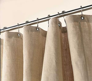 Hemp shower curtain with reinforced metal grommets on curtain rod