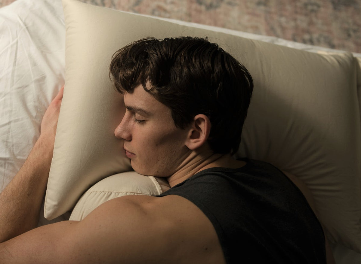 Man resting on buckwheat pillow for natural sleep comfort