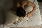 man sleeping with sleeping bean body pillow and kapok head pillow