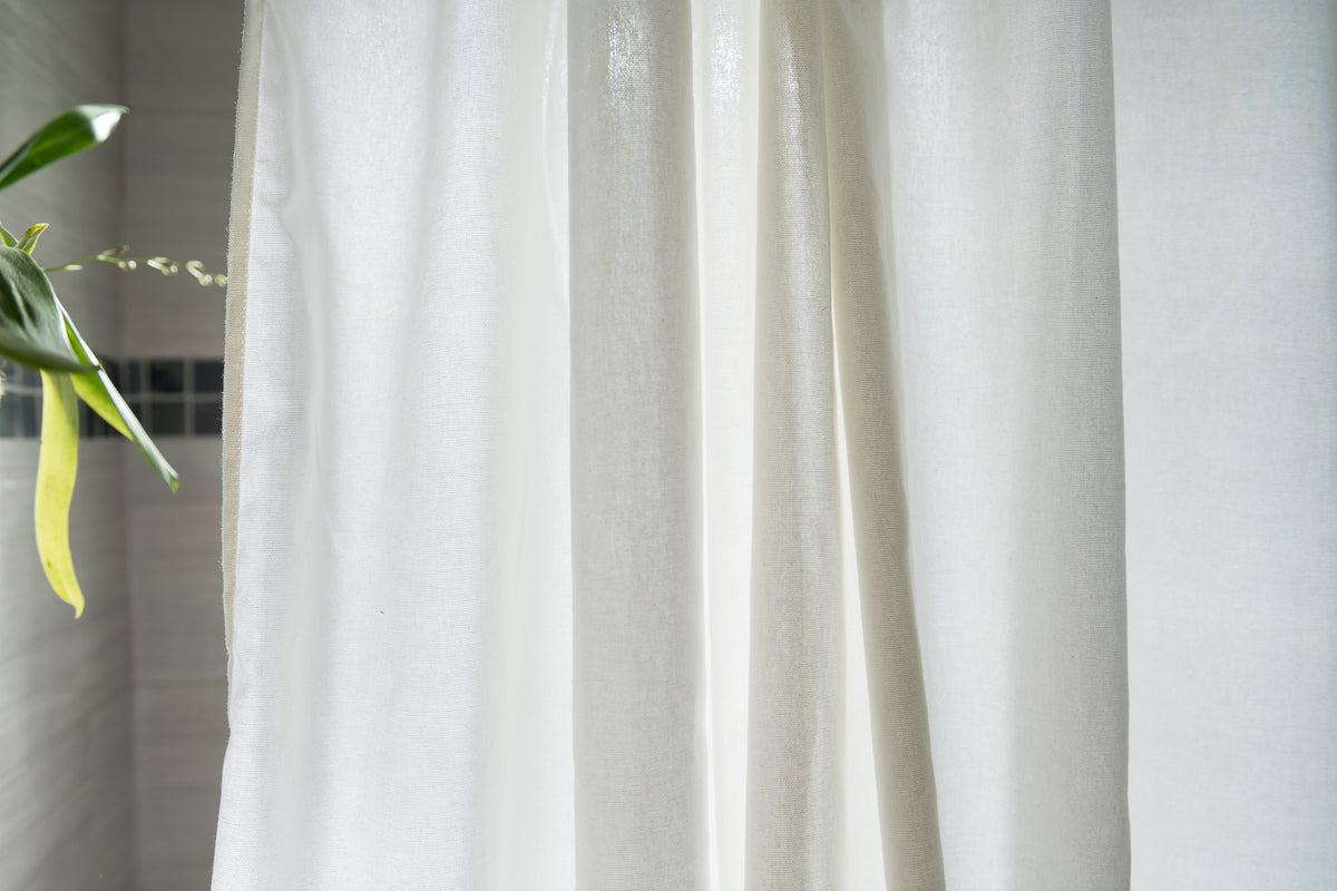 Close-up of white cotton shower curtain fabric, soft breathable weave