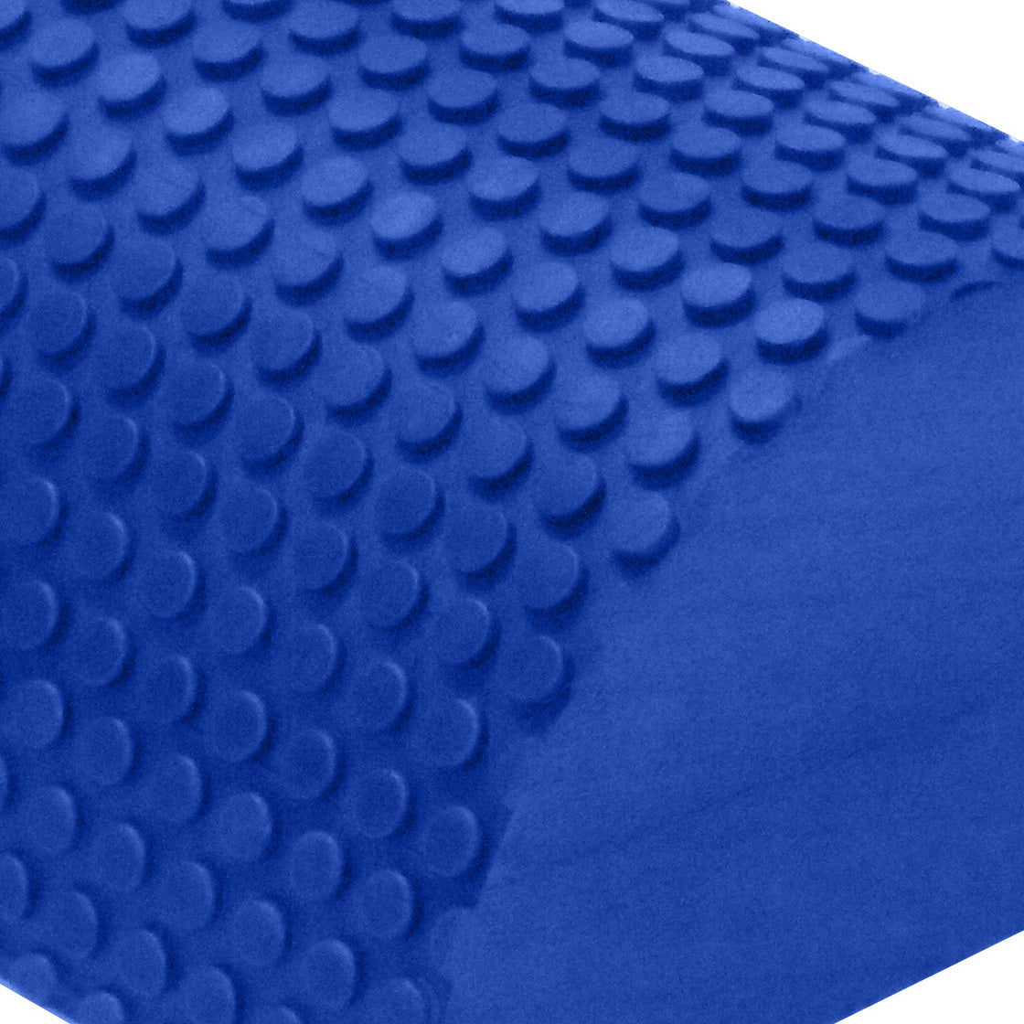 Close-up of textured blue EVA foam roller surface with anti-slip raised pattern