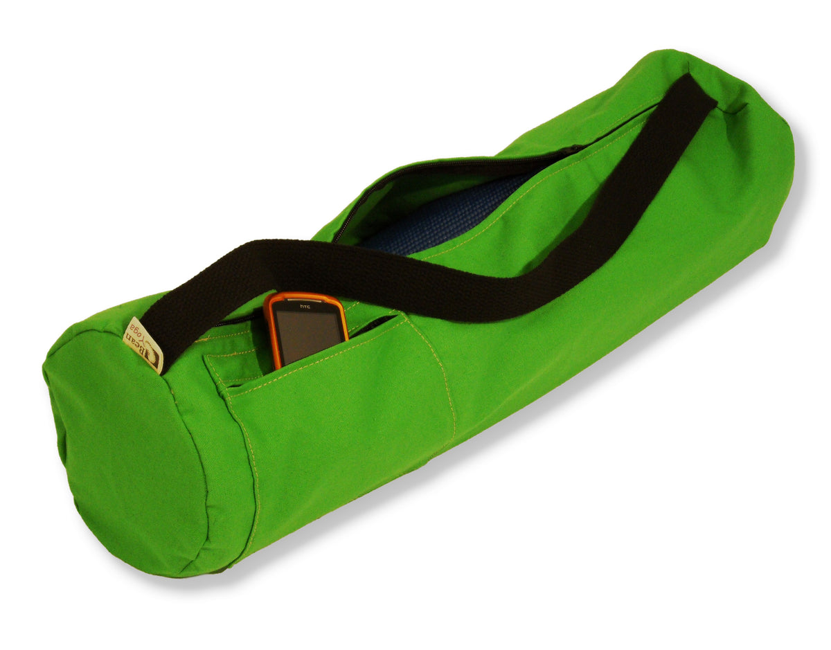 Bright green cotton yoga mat bag with black strap and spacious interior