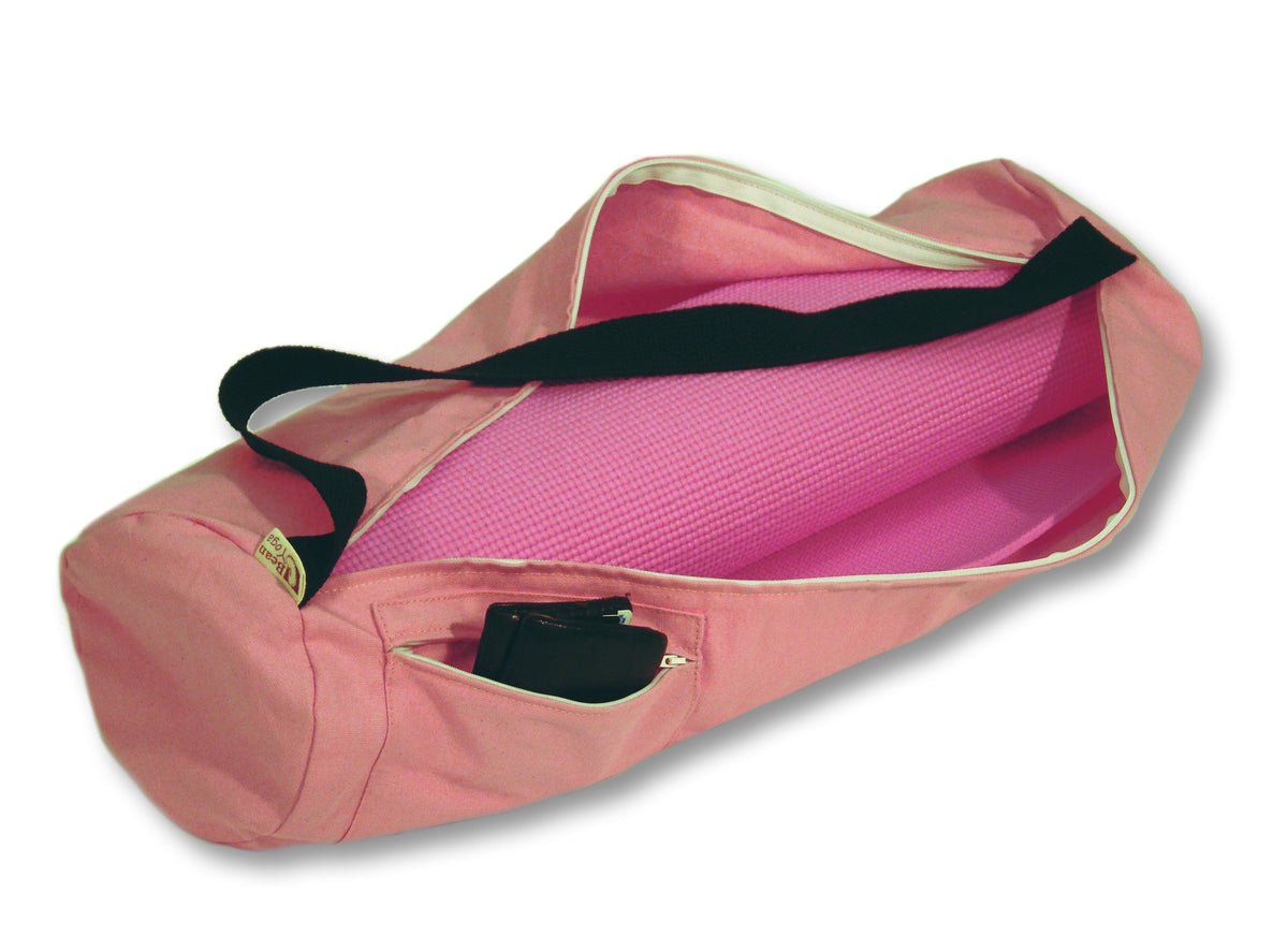 Pink cotton yoga mat bag with contrasting interior and shoulder strap