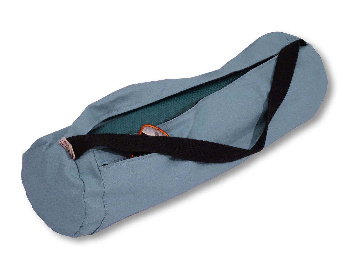 Light gray durable cotton yoga mat bag with black strap and wide opening