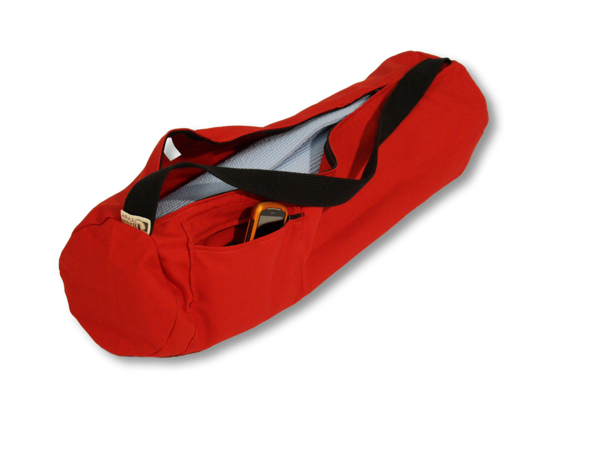 Bright red cotton yoga mat bag with wide opening and adjustable strap