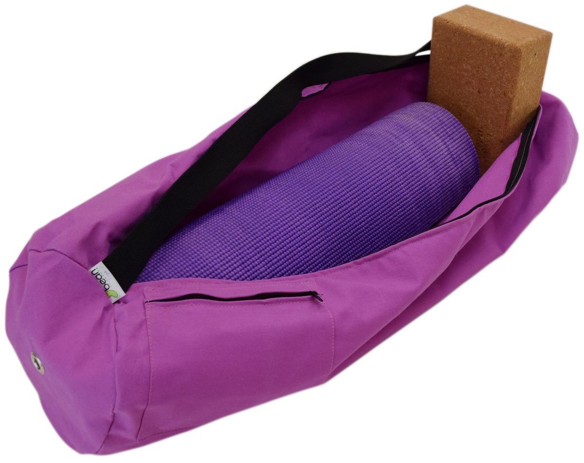 Purple yoga mat bag with wooden block accessory inside