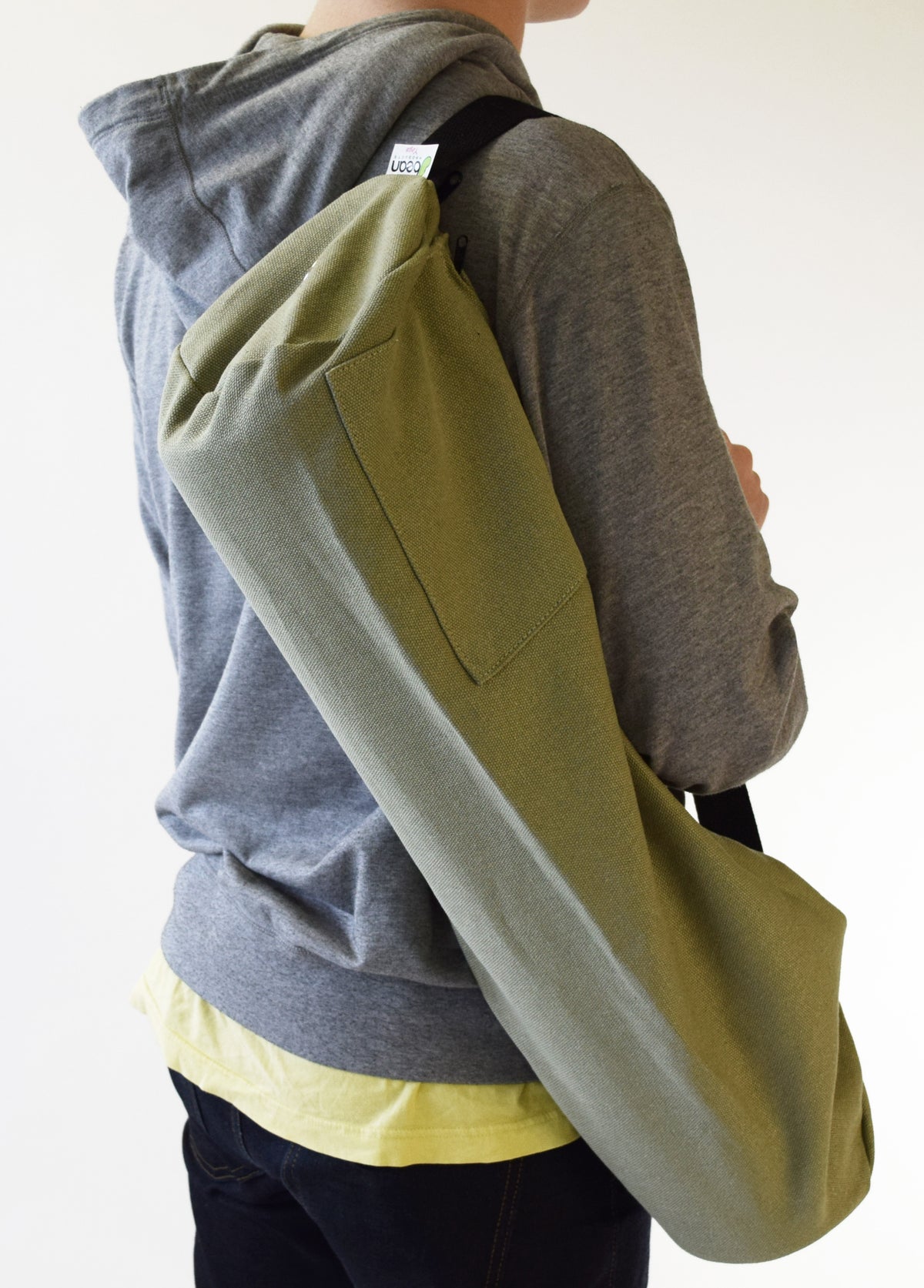 Green handcrafted hemp yoga mat bag carried crossbody style