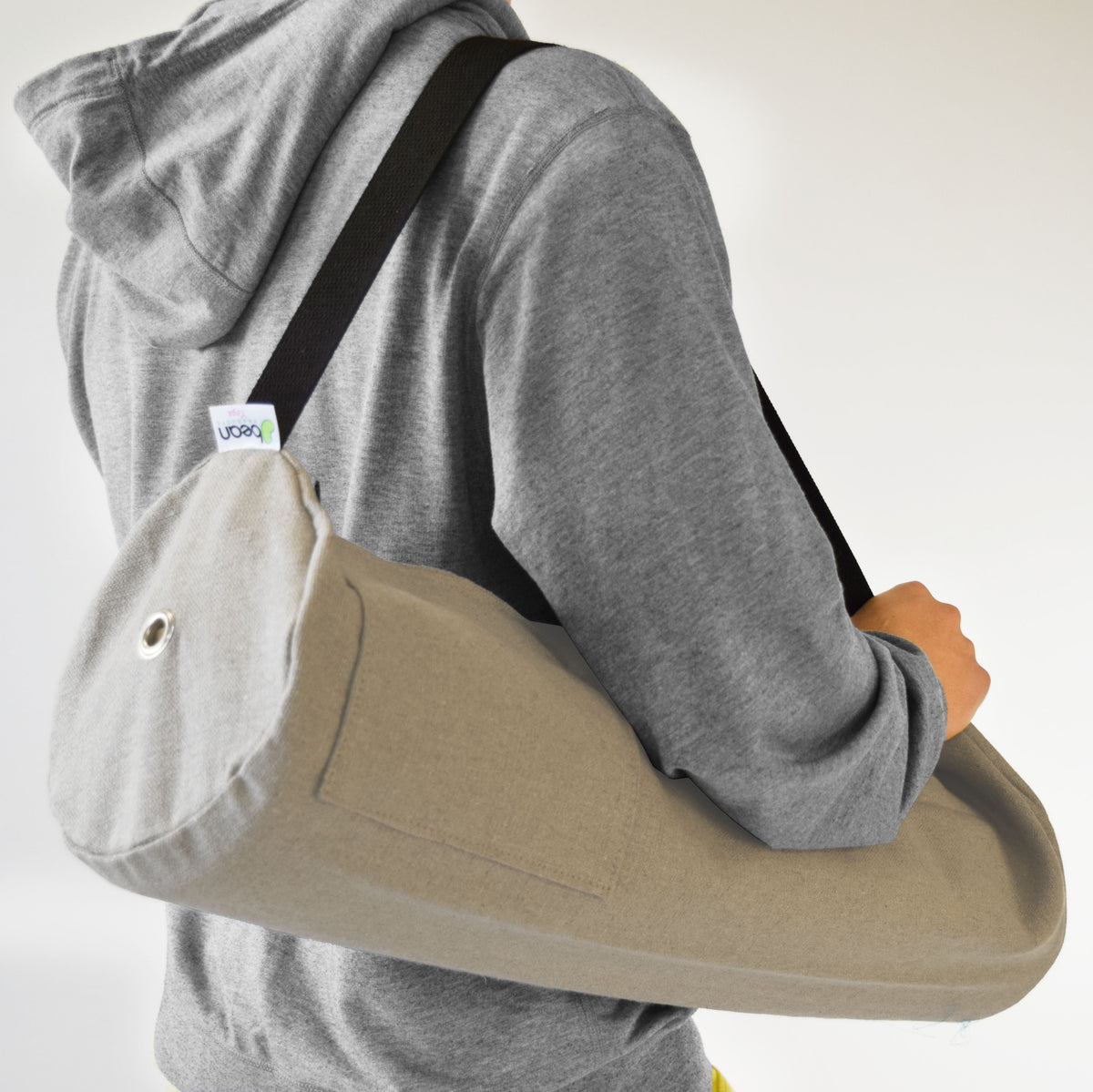 Beige handcrafted hemp yoga mat bag worn crossbody with spacious design
