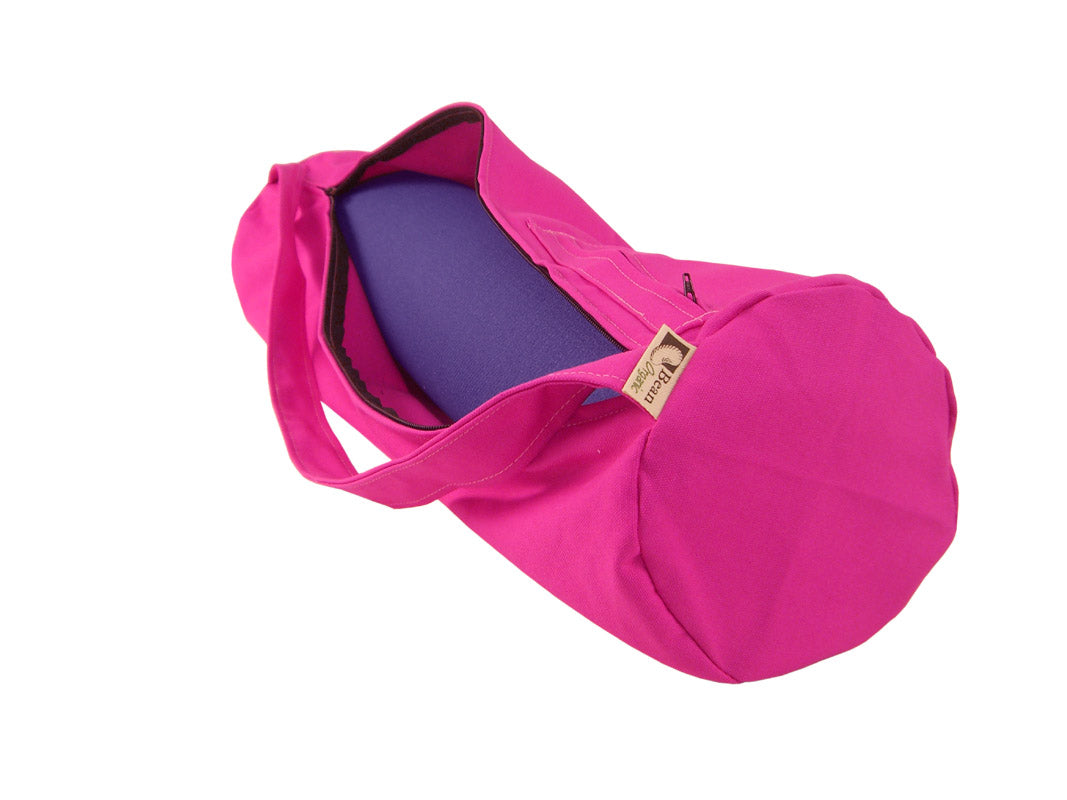 Bright pink yoga mat bag with drawstring closure and strap