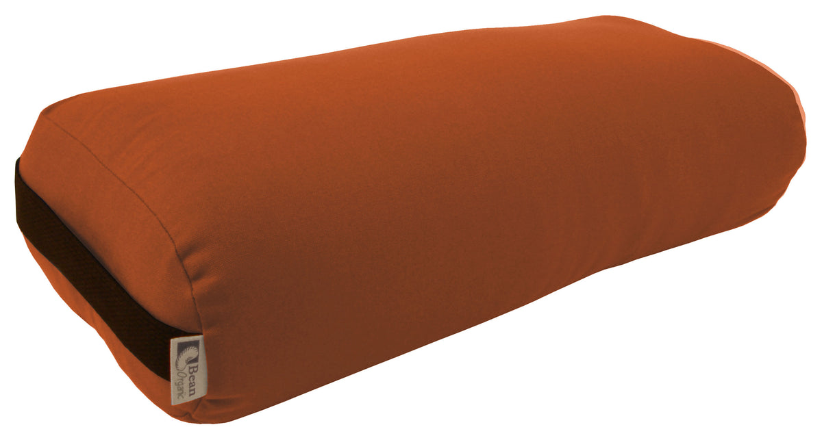 Tan round yoga bolster made from organic cotton, cylindrical support cushion for restorative yoga and meditation