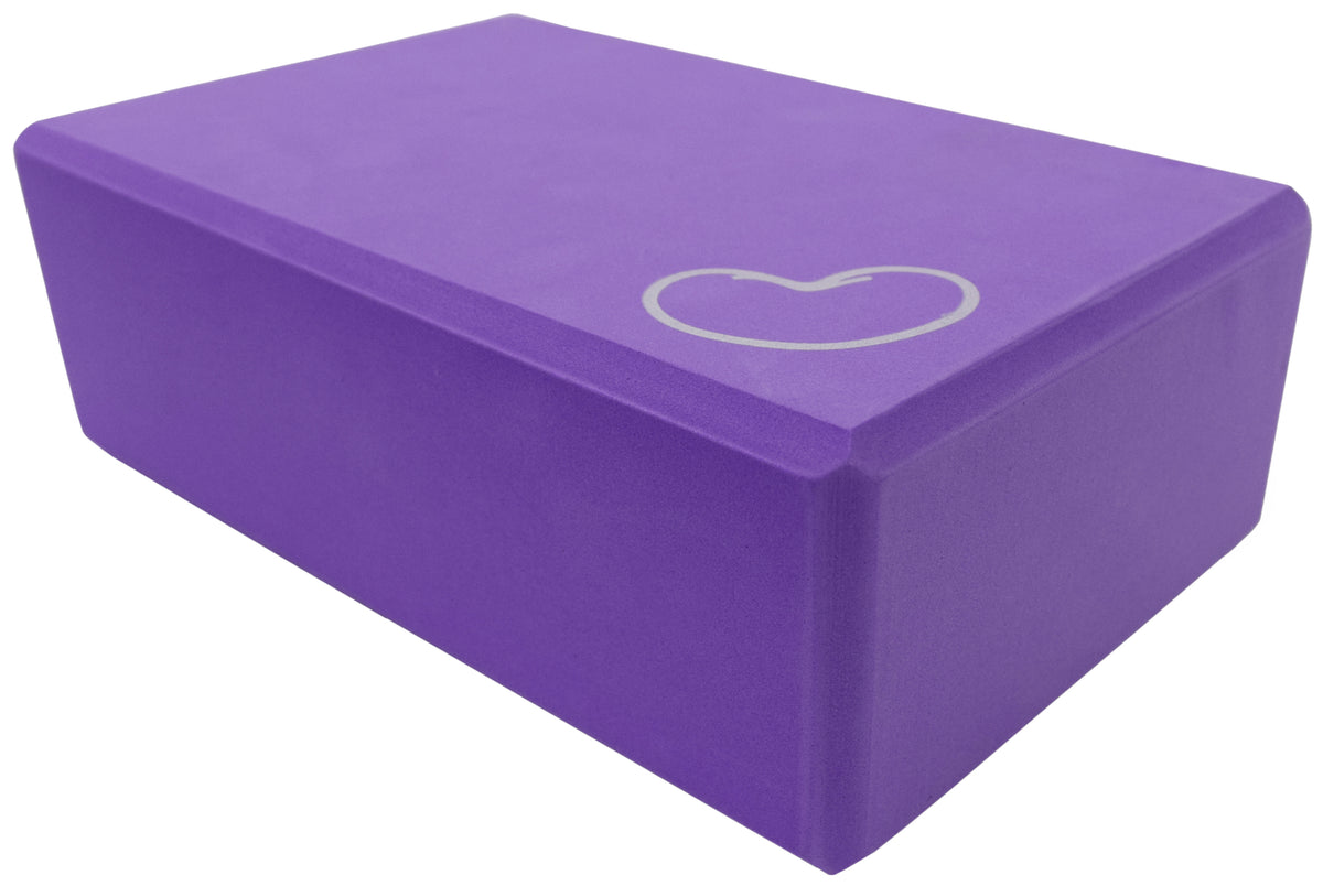 Purple foam yoga block for improving posture, balance, and yoga poses