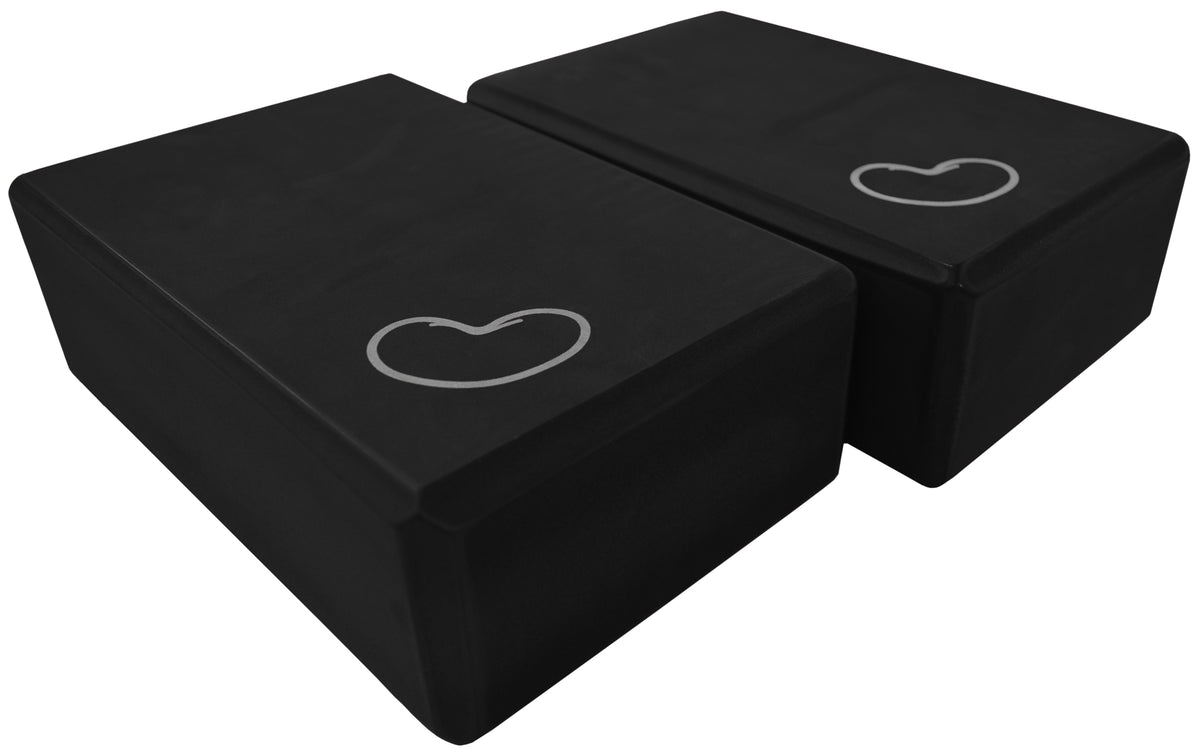 Two black lightweight yoga blocks stacked showing durable foam construction for workouts
