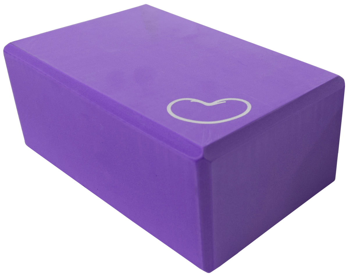 Purple foam yoga block for stretching support and improving flexibility in yoga