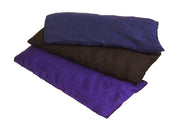 Black silk eye pillow small, stacked with purple and navy variants, soft relaxation mask