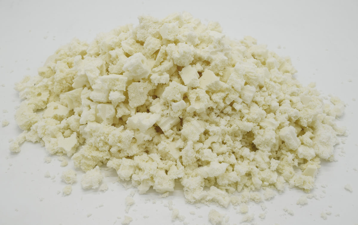 Small pile of shredded organic latex foam fill isolated on white background