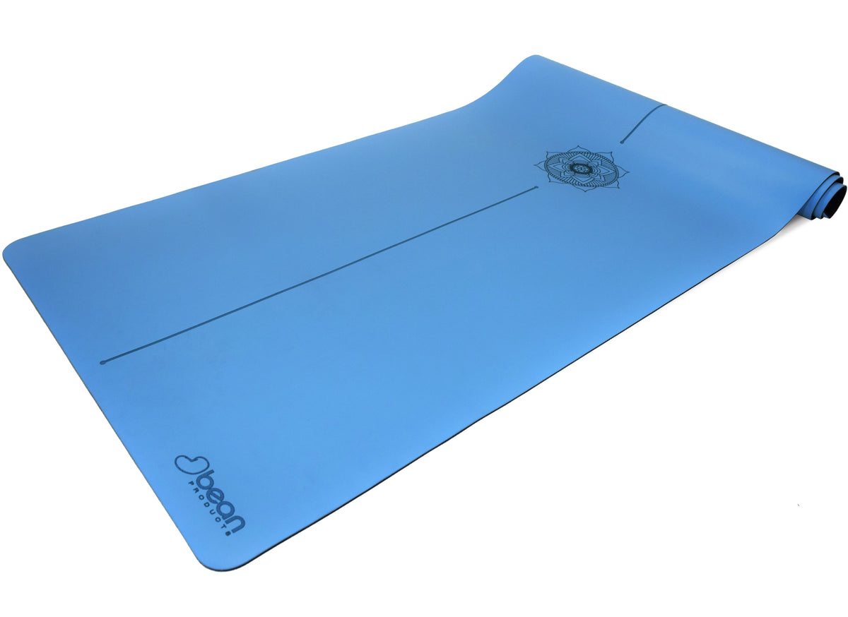 Blue yoga mat with non-slip PU surface and rounded corners flat lay