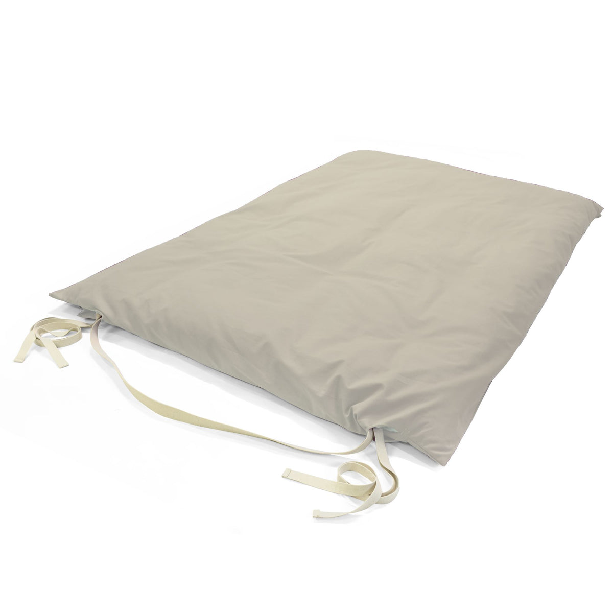 Beige cotton Thai massage mat folded flat with fabric ties