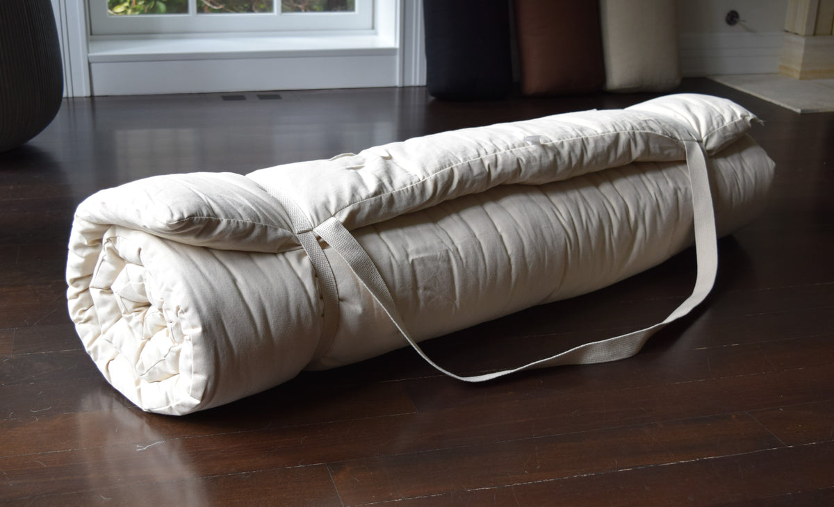 Rolled 54x80 cotton massage mat for storage and transport, natural color