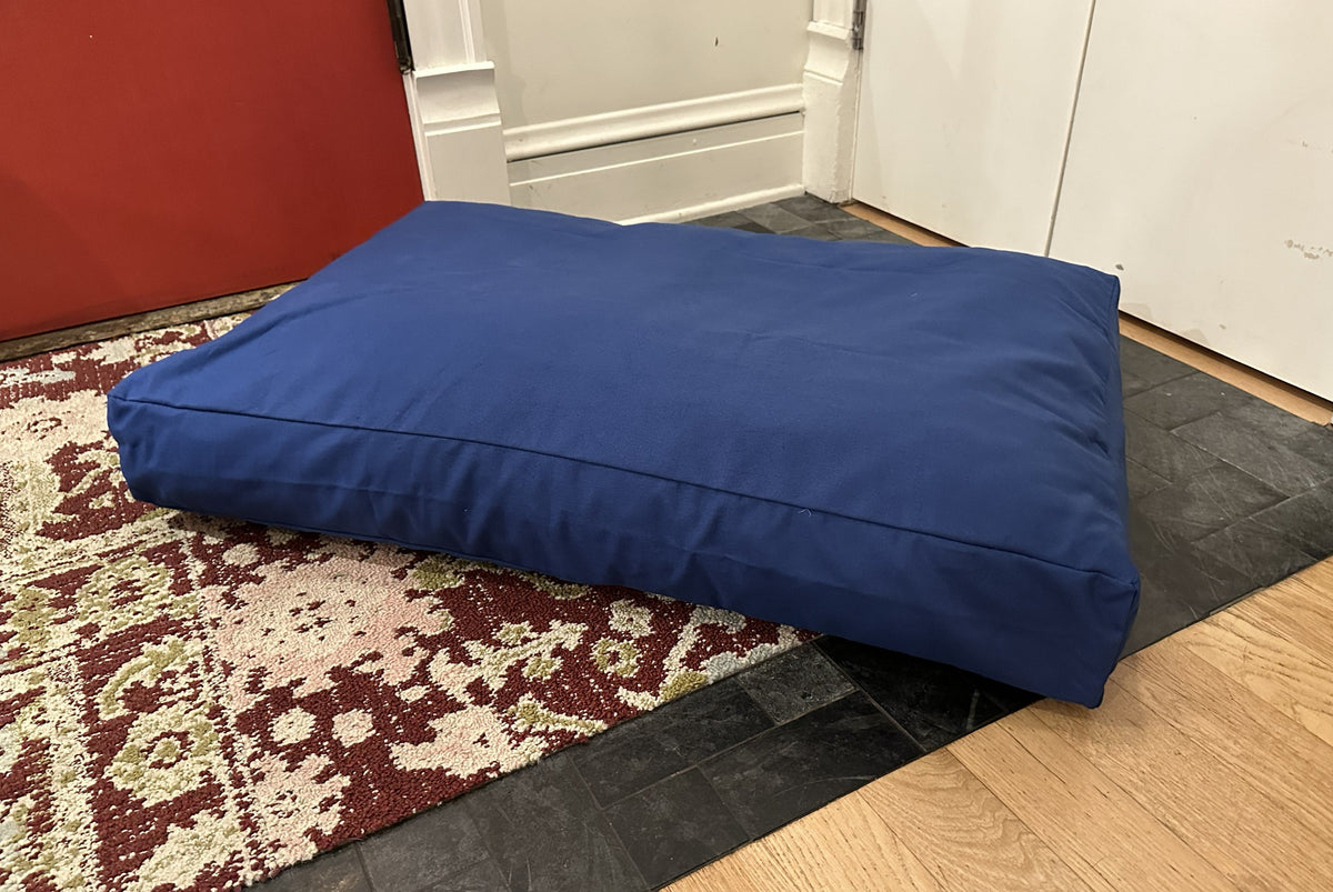 Blue cotton duck canvas dog bed with lightweight foam filling for pet comfort