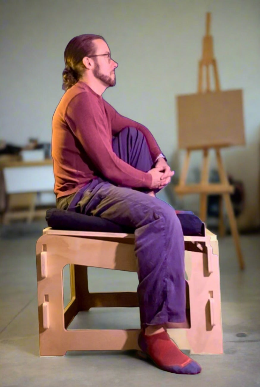 Relaxed meditation pose on ergonomic active sitting platform chair