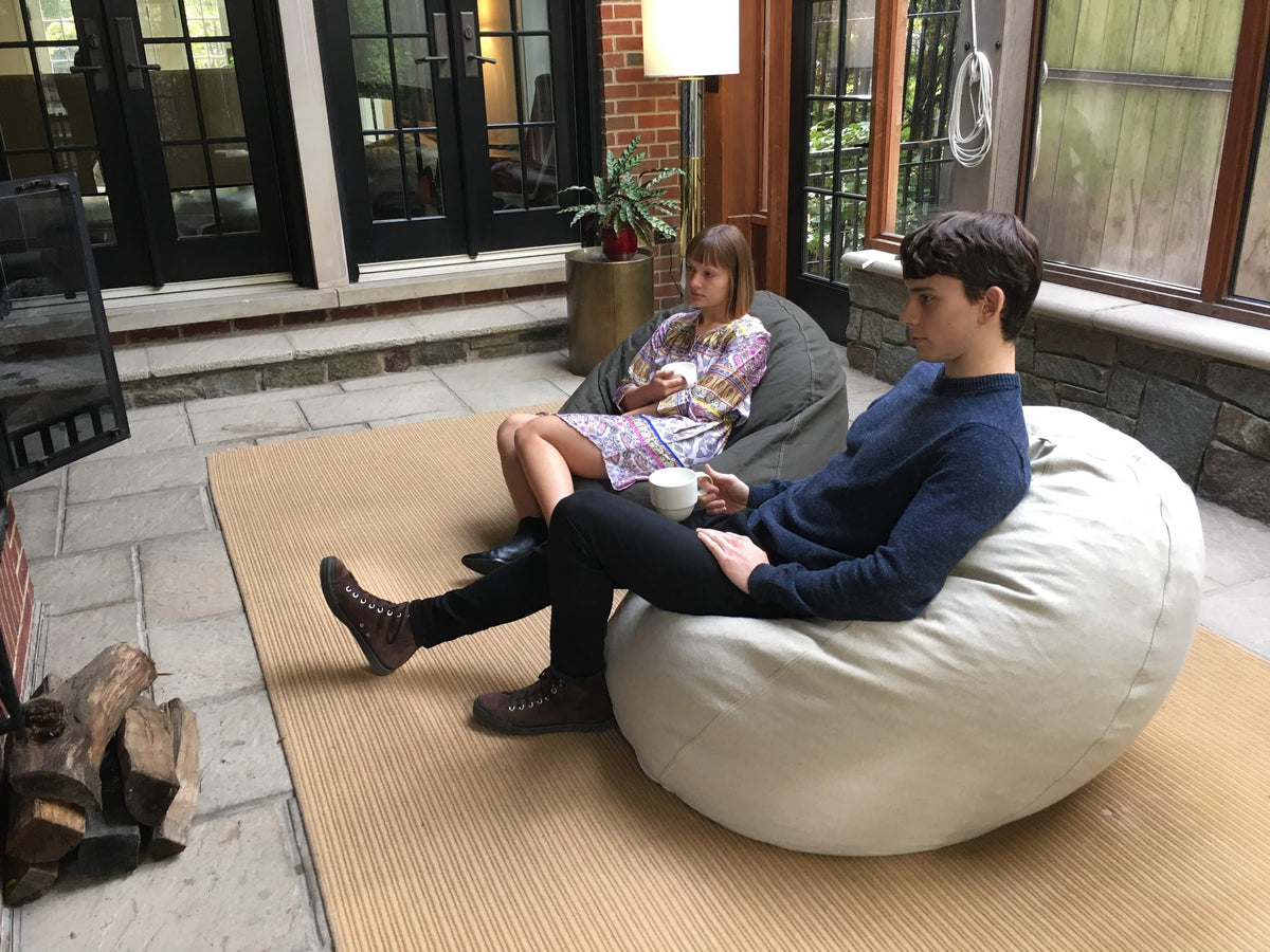 Person relaxing on hemp bean bag chair lounger comfortable seating adult teen size organic hemp fabric
