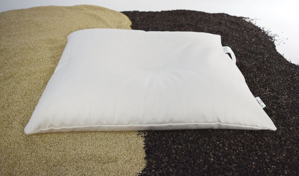 Pillow fabric layered over buckwheat and millet hulls illustrating natural materials and construction