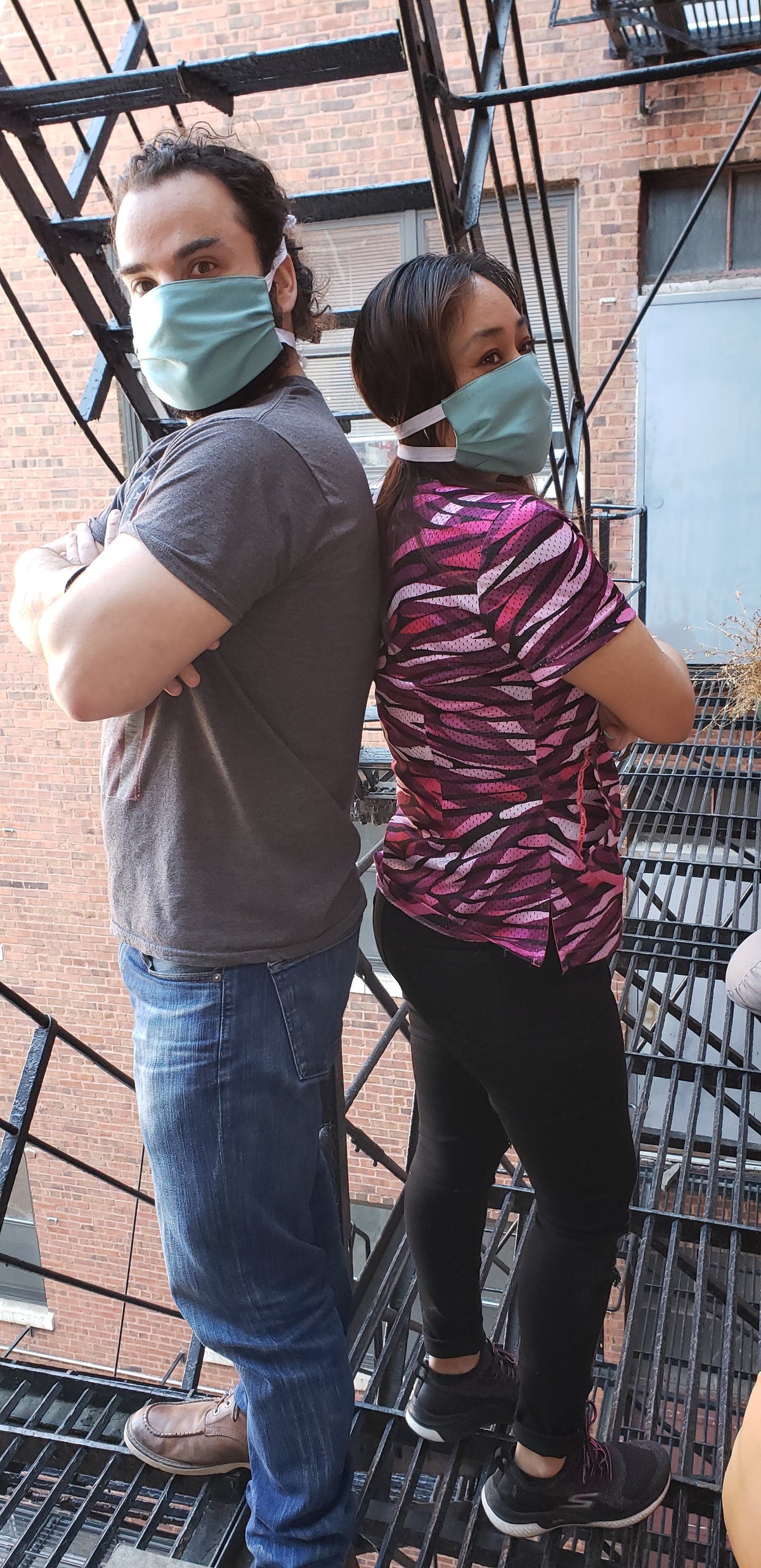 man and woman wearing protective masks