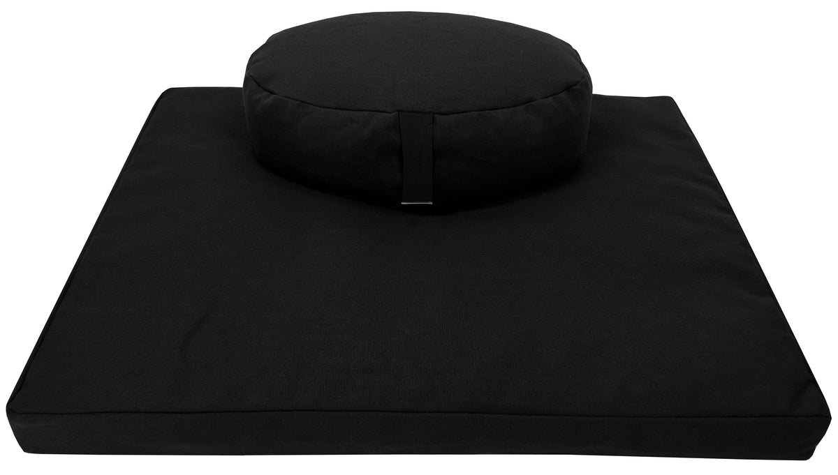 Black round zafu cushion paired with zabuton mat in hemp fabric, filled with organic buckwheat hulls