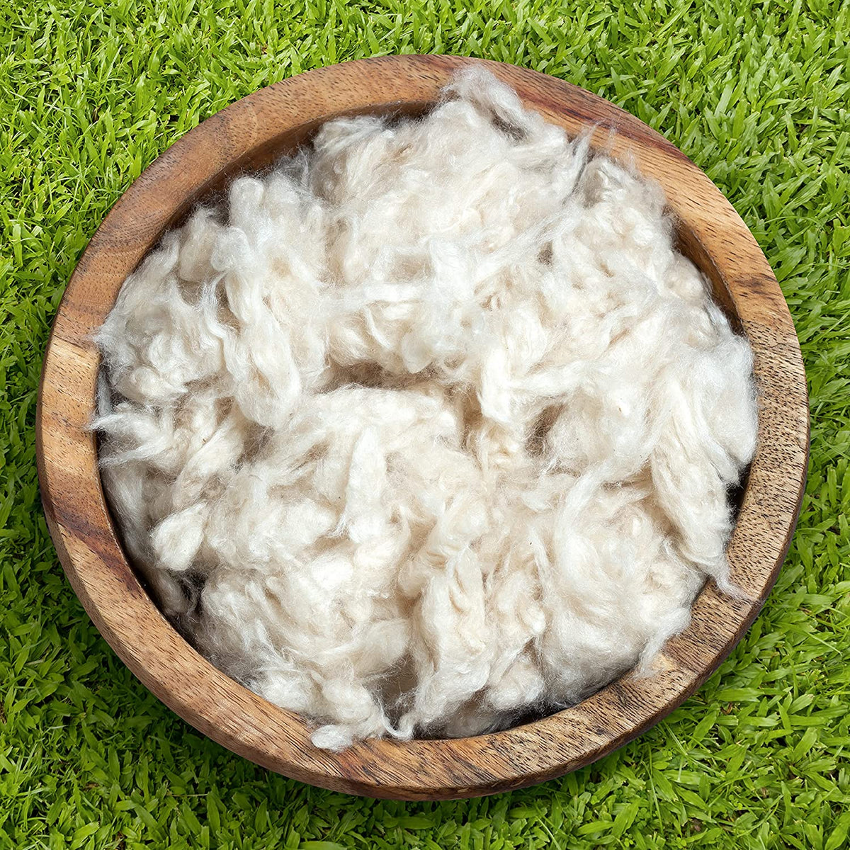 Natural kapok fiber filling in wooden bowl, organic eco friendly stuffing material for pillows and cushions