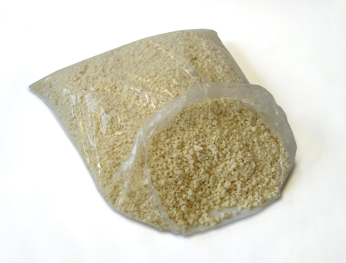 Clear bag filled with organic shredded latex foam stuffing for DIY projects