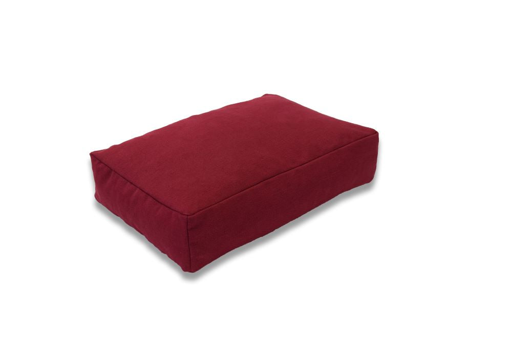Red hemp dog bed with soft cover and supportive foam interior