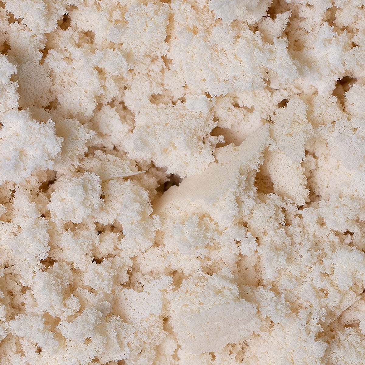 Detailed view of organic latex foam chunks for natural pillow stuffing